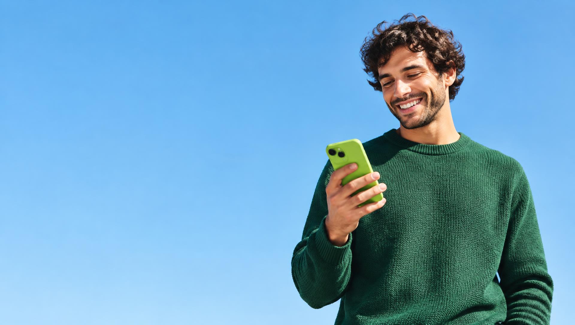 Sales professional enjoying his morning with a phone in hand